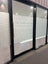 Glass door with decorative window frosting and text 'The Taieri Room' in a room.